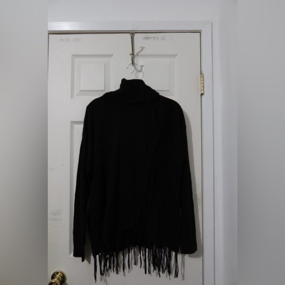 Michael Kors. Black turtle neck. Long sleeve top/poncho. Fringe bottom